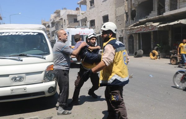 A member of the White Helmets transports a child injured in a Russian air strike in rural Idlib on June 6, 2019. [White Helmets]