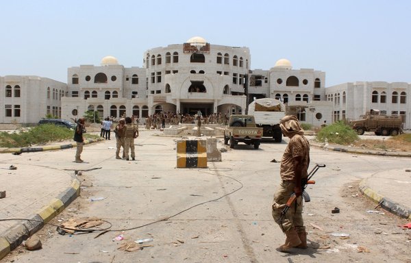 Yemeni forces walk in Zinjibar on August 16, 2016, after they entered the Abyan provincial capital following an offensive backed by Arab coalition air strikes to recapture the city from al-Qaeda. [Saleh al-Obeidi/AFP]