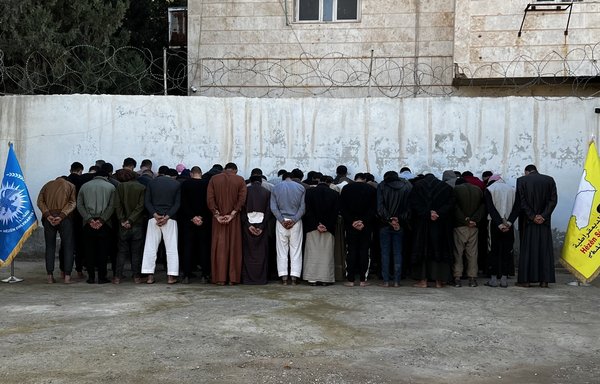 Security forces participating in the SDF-led Operation al-Jazeera Thunderbolt in January guard detainees arrested in eastern Syria. [SDF Press Centre]
