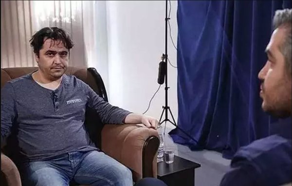 Behind the scenes of Rouhollah Zam's televised 'confessions' in 2020. IRIB's Ali Rezvani sitting in front of Zam with his back to the camera. Zam was executed two months later. [Tasnim]