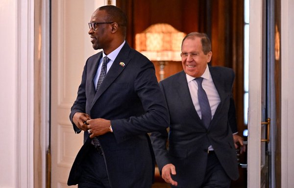 Russian Foreign Minister Sergey Lavrov and his Malian counterpart Abdoulaye Diop enter a hall during their meeting in Moscow on May 20. [Yuri Kadobnov/Pool/AFP]