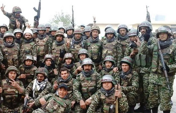 IRGC-backed militiamen are seen here in Syria in an undated photo. [Al-Aalam Institute for Studies]