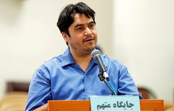 Ruhollah Zam, a former opposition figure who had lived in exile in France and had been implicated in anti-government protests, speaks during his trial at Iran's Revolutionary Court in Tehran on June 2, 2020. He was sentenced to death December 12, 2020. [Ali Shirband/Mizan News/AFP]