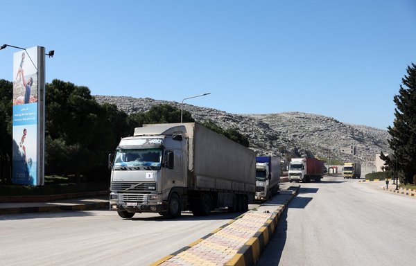 A United Nations aid convoy enters opposition-held northwestern Syria from Türkiye through the Bab el-Hawa crossing on February 9, the first since a devastating earthquake that killed thousands. [Omar Haj Kadour/AFP]
