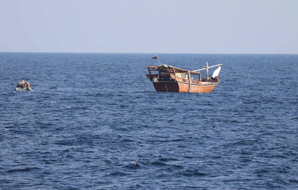 A boarding team from patrol coastal ship USS Chinook approaches a fishing vessel in international waters of the Gulf of Oman on January 6. US naval forces seized 2,116 AK-47 assault rifles from a fishing vessel transiting along a maritime route from Iran to Yemen. [US Navy]