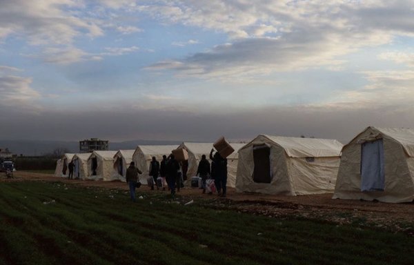 Syrians who lost their homes in the earthquake shelter in tents provided by a humanitarian organisation on February 7. [Ataa Relief]