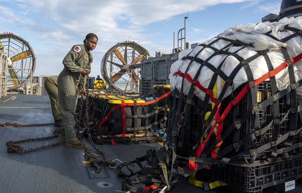 US sailors assigned to Assault Craft Unit 4 prepare material recovered in the Atlantic Ocean from a high-altitude balloon for transport to federal agents at Joint Expeditionary Base Little Creek on February 10. [US Navy]