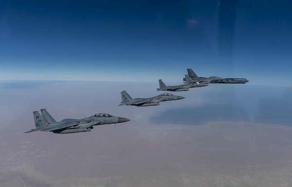 A US Air Force B-52 Stratofortress (far right) flies with Royal Saudi Air Force F-15SAs during a bomber task force mission on January 27, 2021. [US Air Force]