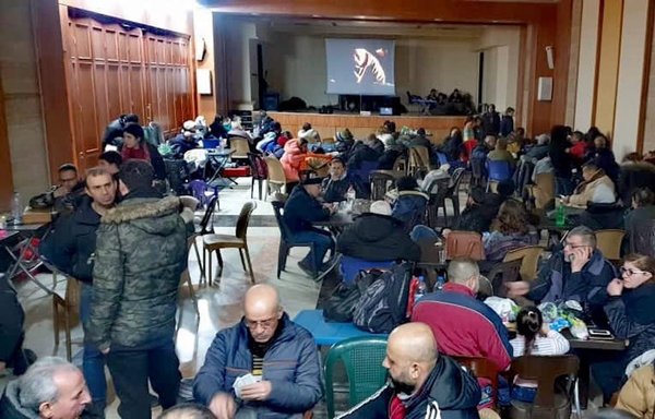 Syrians take refuge from the elements in a shelter set up at the Latin Church in Aleppo following the devastating earthquake. [Latin Church in Aleppo Facebook page]