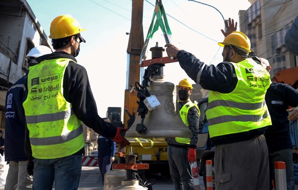 Three bells cast in Normandy, France, are prepared for installation on February 28 in the bell tower of the historic Roman Catholic Dominican Church of Our Lady of the Hour in Mosul. [Zaid al-Obeidi/AFP]