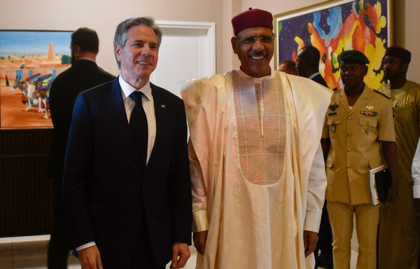 US Secretary of State Antony Blinken (left) poses for a photograph with Nigerien President Mohammed Bazoum during their meeting in Niamey, Niger, on March 16. [Boureima Hama/Pool/AFP]