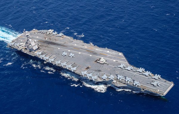 Aircraft attached to Carrier Air Wing (CVW) 8 sit on USS Gerald R. Ford's (CVN 78) flight deck as the ship steams through the Atlantic Ocean last April 13. [US Navy]