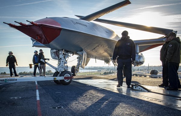 Sailors and Boeing employees look for discrepancies in the positioning of the Boeing unmanned MQ-25 aircraft aboard the carrier USS George H.W. Bush (CVN 77) on December 9, 2021. [US Navy]