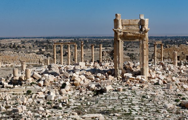 A picture shows a partial view of the damaged Temple of Bel, in Syria's Roman-era ancient city of Palmyra on February 7, 2021, in Homs province. [Louai Beshara/AFP]