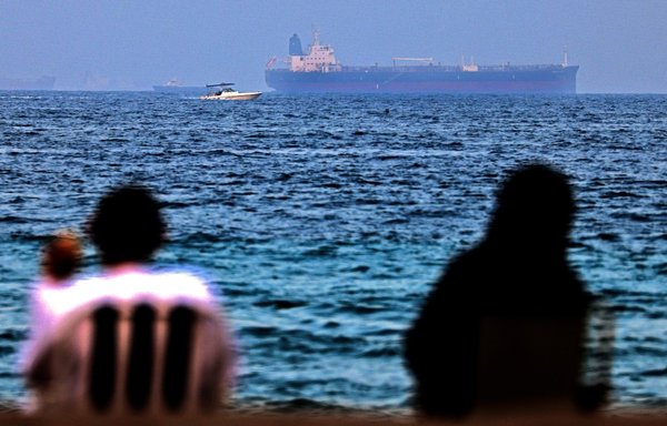 The Israeli-linked tanker MT Mercer Street is seen off the port of Fujairah in the United Arab Emirates on August 3, 2021. On July 29, two crew members were killed in a drone attack off Oman, blamed on Iran. [Karim Sahib/AFP]