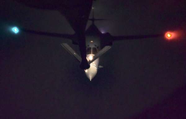 A B-1B Lancer is refueled in the early morning on April 13 over the US Central Command area of responsibility. [CENTCOM]
