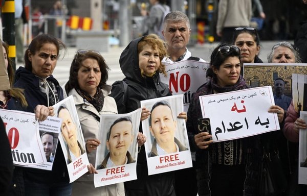 Iranians gather in Brussels to protest Swedish-Iranian citizen Ahmad Reza Djalali's death sentence in this undated photo. Djalali, an emergency medicine specialist, was detained in Iran in April 2016. [Independent Persian]