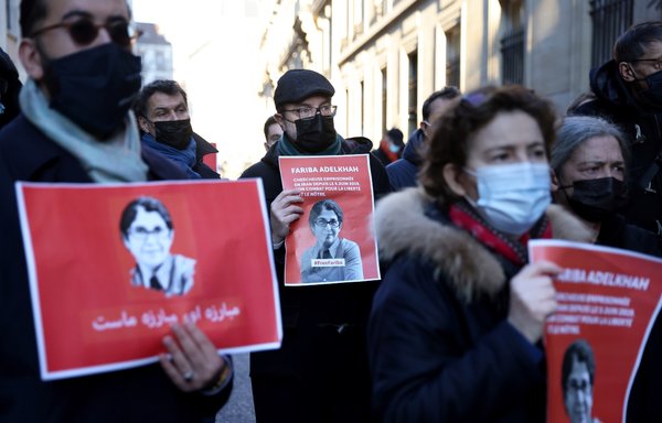 Colleagues of French-Iranian academic Fariba Adelkhah protest her detainment in Iran in front of Science-Po in Paris on January 13, 2022. [Thomas Coex/AFP]