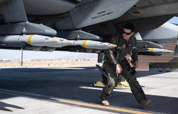 An A-10 pilot inspects 16 Small Diameter Bombs (SDBs) prior to flight at Nellis Air Force Base in Nevada, April 20. [US Air Force]