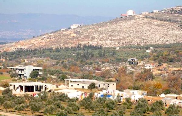 Members of a Hizbullah-backed Lebanese smuggling network that calls itself Asyad al-Hudoud operate in the Wadi Khaled area, seen here. [Al-Mashareq]
