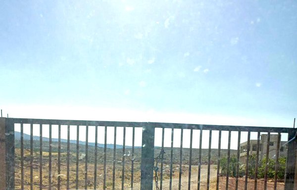 A gate separates the Akroum area in northern Lebanon's Akkar district from the Syrian border, where a group calling itself Asyad al-Hudoud has been smuggling goods and wanted criminals. [Al-Mashareq]