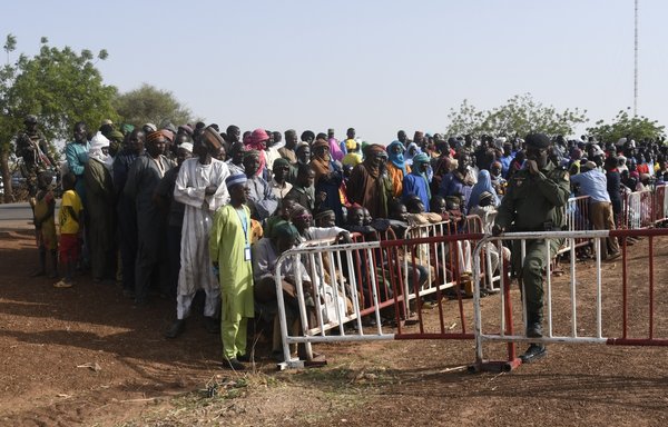 People displaced by extremist violence are seen on June 2, 2022, in Makalondi, Niger, in the middle of the 'three borders' zone (Niger-Mali-Burkina), which since 2017 has been the scene of bloody attacks carried out by extremists. [Boureima Hama/AFP]