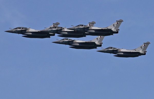 French-made Rafale fighter aircraft of the Qatar Air Force perform during a military parade to mark Qatar's national day celebration, in the capital Doha on December 18, 2020. [AFP]