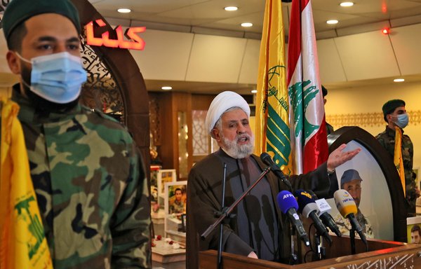 Deputy chief of Lebanese Hizbullah Naim Qassem delivers a speech during a ceremony in southern Beirut on February 15, 2022. Qassem's personal website was one of 13 Hizbullah-controlled web domains that the US Justice Department seized on May 11, 2023. [Anwar Amro/AFP]