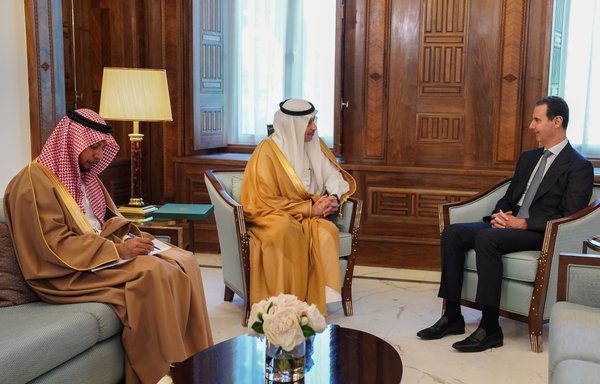 Syrian president Bashar al-Assad receives an invitation to attend the upcoming Arab League summit from Saudi ambassador to Jordan Nayef bin Bandar al-Sudairi on May 10. [Syrian presidency Twitter account]