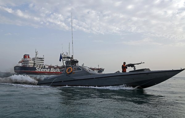 IRGC Navy boat patrols around the British-flagged tanker Stena Impero as it's anchored off the Iranian port city of Bandar Abbas on July 21, 2019. [Hasan Shirvani/Mizan News Agency/AFP]