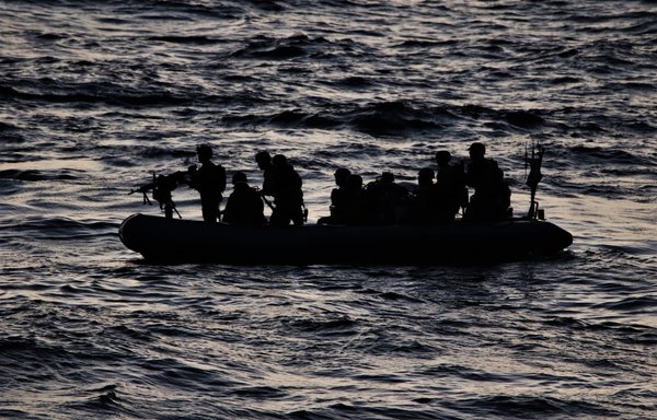 US Navy personnel assigned to guided-missile destroyer USS Paul Hamilton conduct visit, board and search and seizure operations in the Gulf of Oman March 20. [US Navy]
