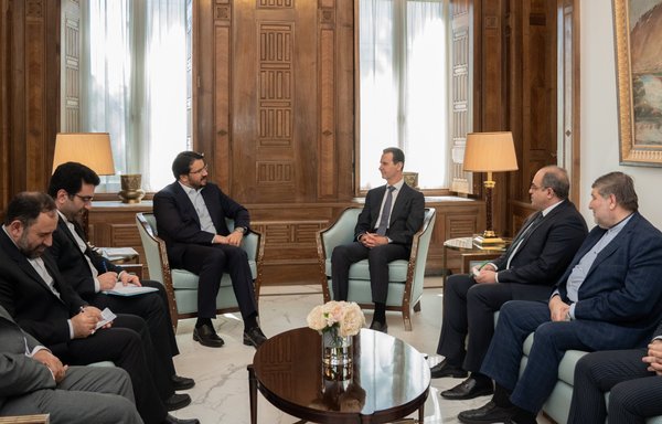Syrian President Bashar al-Assad meets with an Iranian delegation headed by Iranian Transportation Minister Mehrdad Bazrpash on April 26. [Syrian Presidency Twitter account]