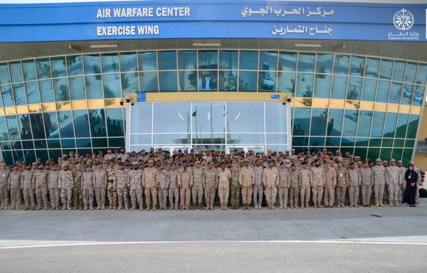 Participating forces in Eagle Resolve 23 from Saudi Arabia, the United States and other Gulf countries pose for a group picture on 22 May 2023 at the Air Warfare Centre at King Abdulaziz Air Base in Saudi Arabia. [Saudi Ministry of Defence]