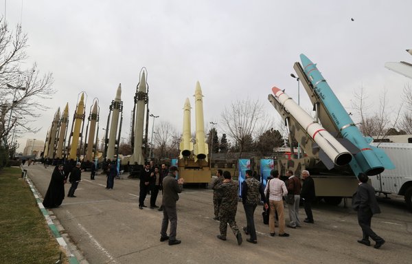 Iranians visit a weaponry and military equipment exhibition in Tehran on February 2, 2019. [Atta Kenare/AFP]