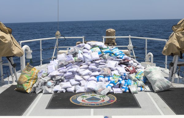 Bags of illegal drugs sit on the deck of US Coast Guard fast response cutter USCGC Glen Harris for inventory during a seizure in the Gulf of Oman May 10. The vessel was interdicted in international waters after departing Chahbahar, Iran. [US Navy]