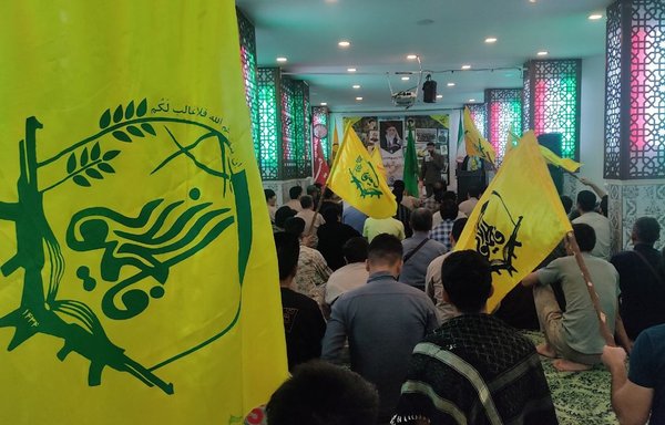 Elements of the IRGC-led Fatemiyoun Division militia take part in a May 14 celebration in Syria of the 10th anniversary of the militia's founding. [Fatemiyoun Telegram channel]