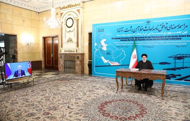 Bankrupt Iran inks deal for railway on corridor Moscow claims can rival Suez