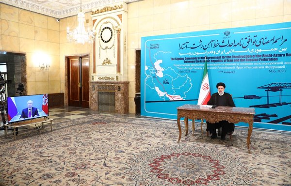 Russian president Vladimir Putin joins Iranian president Ebrahim Raisi via video link on May 17 for the signing ceremony of the Rasht-Astara railway. [president.ir]