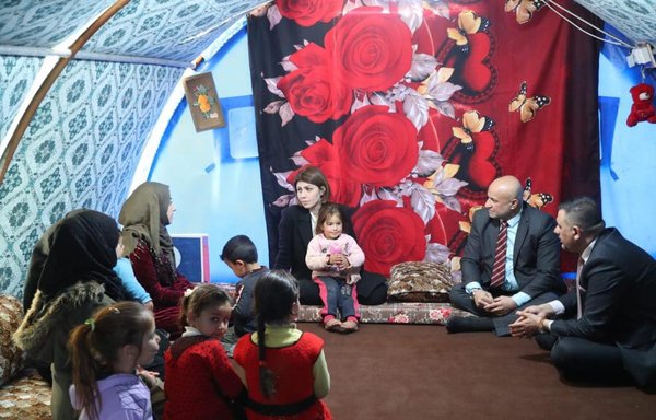 Iraqi Minister of Migration Evan Faeq Jabro and Iraqi officials check on families in al-Jadaa camp near Mosul on February 22. [Iraqi Ministry of Migration and Displacement]