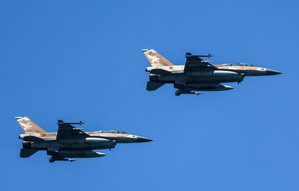 Israeli air force F-16 Falcon fighter aircraft fly over during an air show in Tel Aviv on April 26. [Jack Guez/AFP]