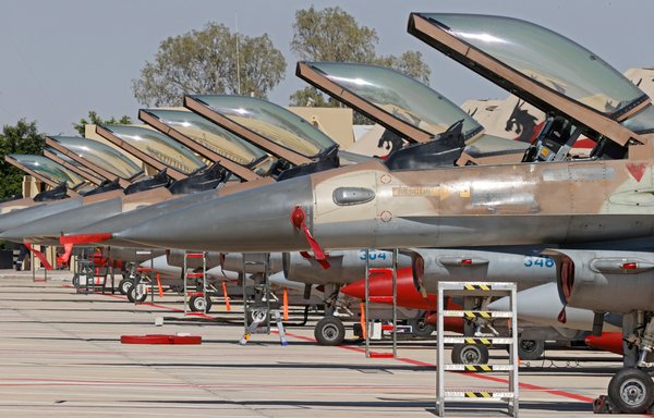 Israeli air force F-16 fighters are seen during the 'Blue Flag' multinational air defence exercise at the Ovda air force base, north of the Israeli city of Eilat, on October 24, 2021. [Jack Guez/AFP]