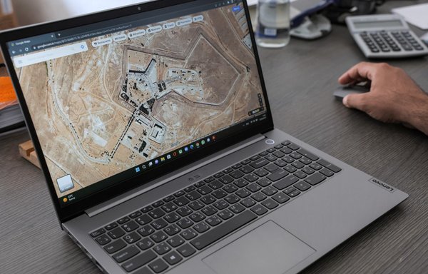 A satellite image of the Syrian regime's Saydnaya prison is seen on a laptop computer on August 12. Up to 100,000 people have died in Syrian regime prisons since 2011. Around 30,000 people are thought to have been held at Saydnaya alone since the start of the conflict. Only 6,000 were released. Most of the others are officially considered missing. [Omar Haj Kadour/AFP]