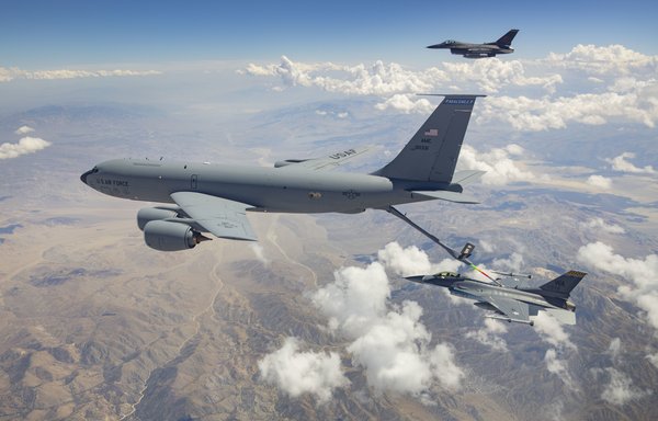 An F-16 Fighting Falcon receives air-to-air refuelling from a KC-135 Stratotanker last July 19. [US Air Force]