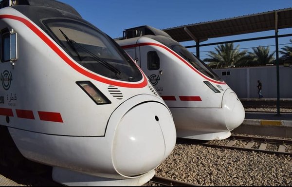 Trains sit on a railway track in Iraq on May 4, 2022. With its Development Road Project, the Iraqi government seeks to build a railway line that will enhance regional trade. [Iraqi Ministry of Transportation Facebook page]