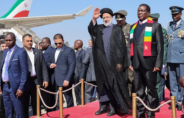 Iranian president Ebrahim Raisi's trip to Africa -- the first by an Iranian president in 11 years -- has been widely touted in Iran's state-affiliated media. Raisi is seen here with Zimbabwe President Emmerson Mnangagwa. [president.ir]