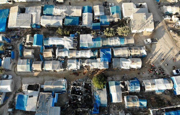 An aerial view taken November 21, 2019, shows the charred remains of a tent following Syrian regime bombardment of al-Qah displacement camp in Idlib province. [Omar Haj Kadour/AFP]