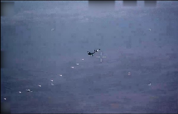 Russian military Su-34 and Su-35 aircraft employ flares in the flight path of a US MQ-9 drone on July 6 over Syria. The United States says Russian forces have displayed increasingly unprofessional and unsafe actions while operating in Syria, threatening the safety of both US and Russian forces. [US Air Force]