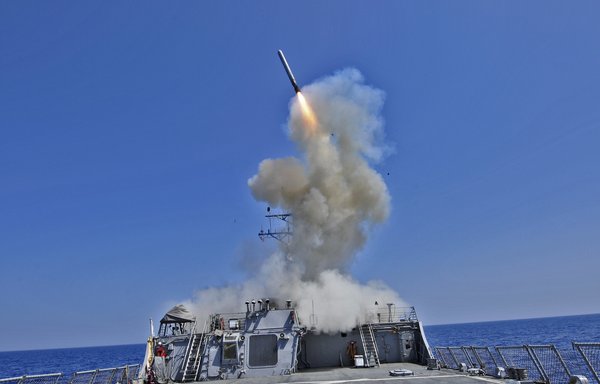 An Arleigh Burke-class destroyer launches a Tomahawk cruise missile. [US Navy]