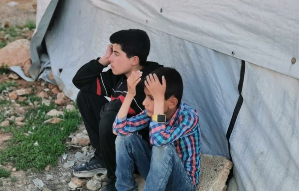 Syrian refugee boys pass the time at a camp in Arsal, Lebanon, on July 24. [Voice of Syrian Refugees-Lebanon]