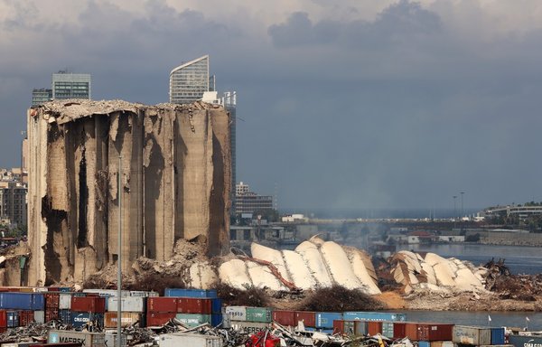 This picture taken last August 22 shows the newly collapsed northern section of the grain silos at the port of Beirut, which were previously partly destroyed by the 2020 port explosion. [Joseph Eid/AFP]